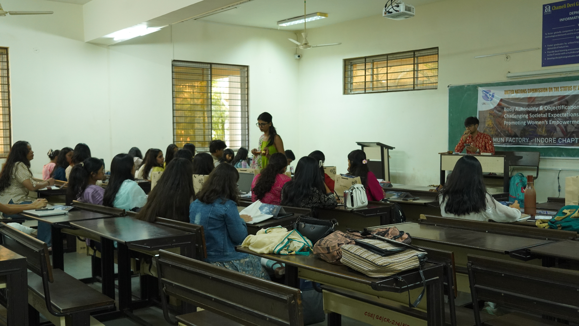 A full committee room during a TMF session with the dais active at the front.