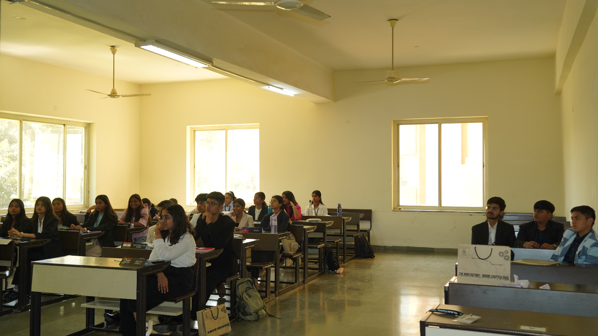A wide classroom view of students participating in a TMF session.