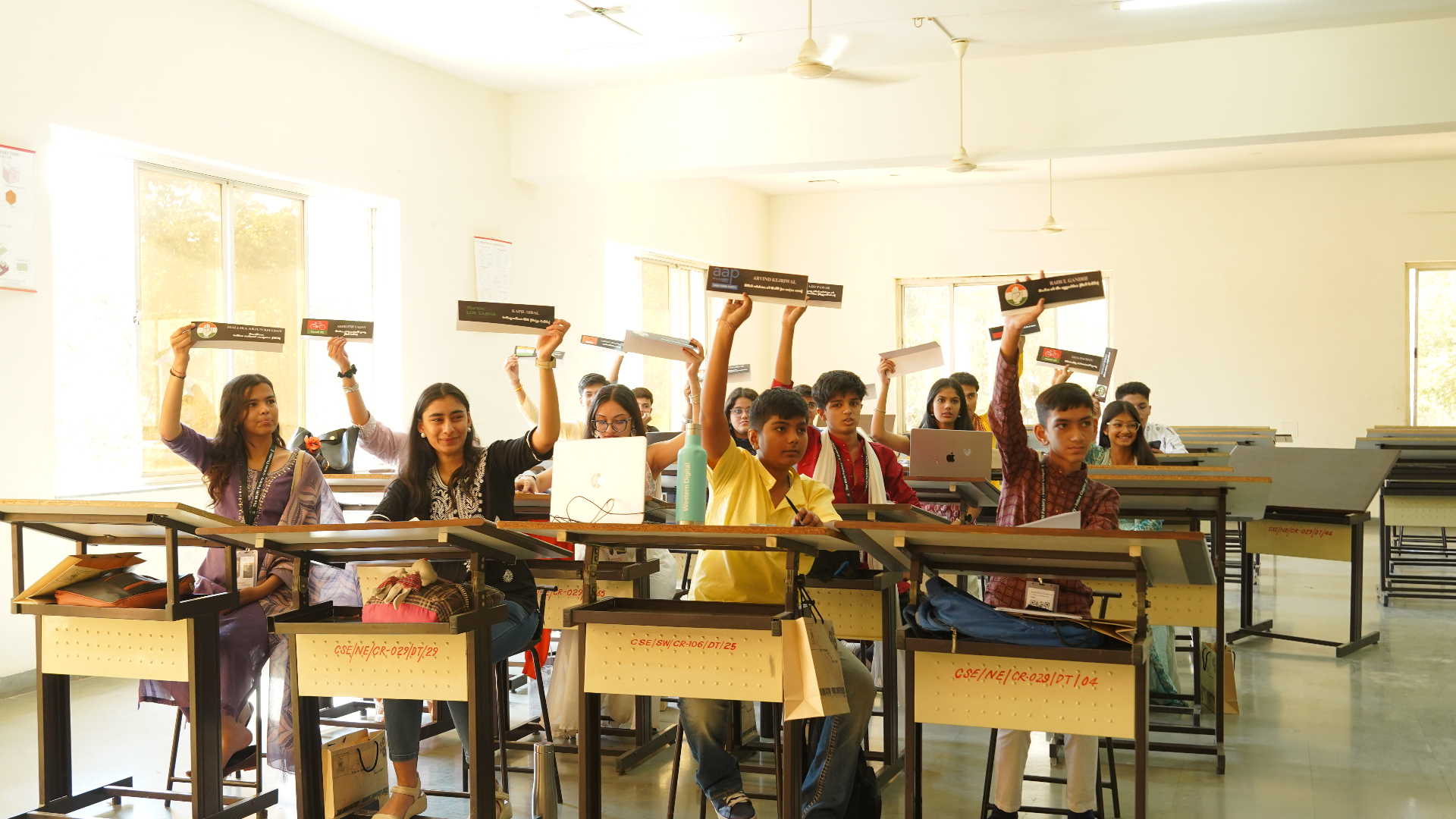 Front-row student delegates taking part in a TMF committee vote.